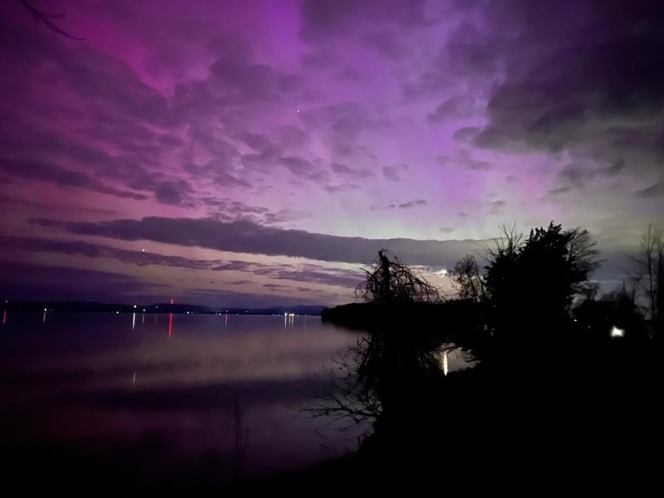 The northern lights brought vibrant colors to the sky and Lake Champlain, as seen from the Colchester Causeway around 11 p.m. on May 10, 2024. The area got a rare glimpse of the aurora borealis.