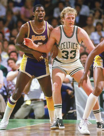 <p>Richard Mackson/Sports Illustrated/Getty</p> From Left: Magic Johnson and Larry Bird