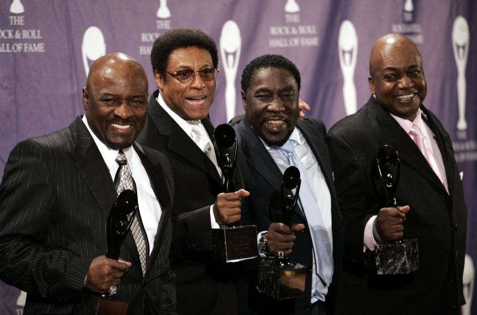 The O'Jays, from left; Walter Williams, Sammy Strain, Eddie Levert and Bobby Massey pose for photos back stage after being inducted into the Rock and Roll Hall of Fame at an induction ceremony,  Monday, March 14, 2005, in New York. (AP Photo/Ed Betz) ORG XMIT: XEJB103 [Via MerlinFTP Drop]