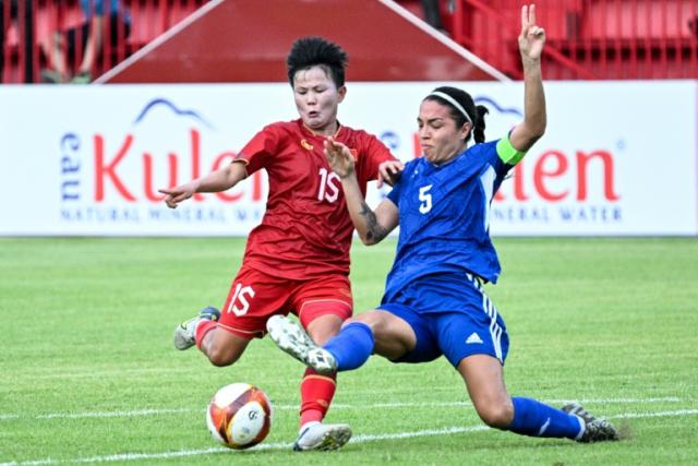 Nguyen Thi Bich Thuy (left) and <a class="link " href="https://sports.yahoo.com/soccer/teams//" data-i13n="sec:content-canvas;subsec:anchor_text;elm:context_link" data-ylk="slk:Philippines;sec:content-canvas;subsec:anchor_text;elm:context_link;itc:0">Philippines</a>' captain <a class="link " href="https://sports.yahoo.com/soccer/players/3780497" data-i13n="sec:content-canvas;subsec:anchor_text;elm:context_link" data-ylk="slk:Hali Long;sec:content-canvas;subsec:anchor_text;elm:context_link;itc:0">Hali Long</a>, who both scored for their respective sides