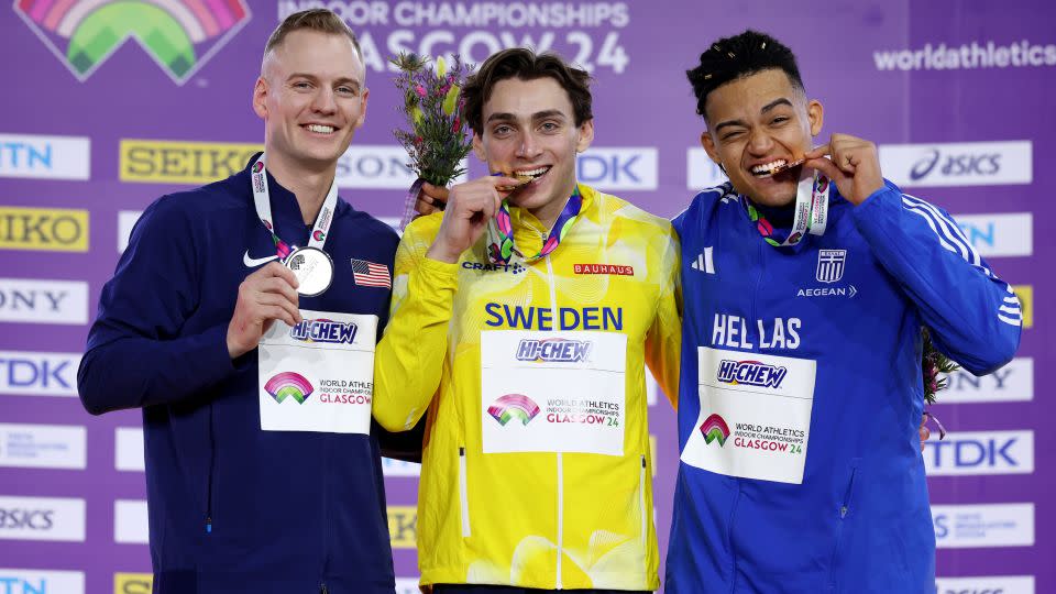 Duplantis (center) celebrates his second world indoor title. - Michael Steele/Getty Images