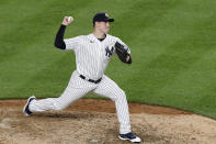 New York Yankees relief pitcher Adam Ottavino winds up during the eighth inning of the team's baseball game against the Boston Red Sox, Sunday, Aug. 2, 2020, at Yankee Stadium in New York. (AP Photo/Kathy Willens)