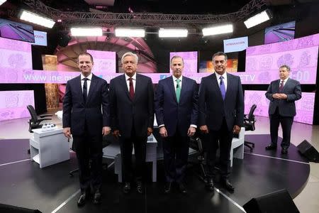 Ricardo Anaya of the National Action Party (PAN), Andres Manuel Lopez Obrador of the National Regeneration Movement (MORENA), Jose Antonio Meade of the Institutional Revolutionary Party (PRI) and independent candidate Jaime Rodriguez Calderon pose for a photo at their third and final debate in Merida, Mexico in this June 12, 2018 handout released to Reuters by the National Electoral Institute (INE). National Electoral Institute/Handout via REUTERS/Files