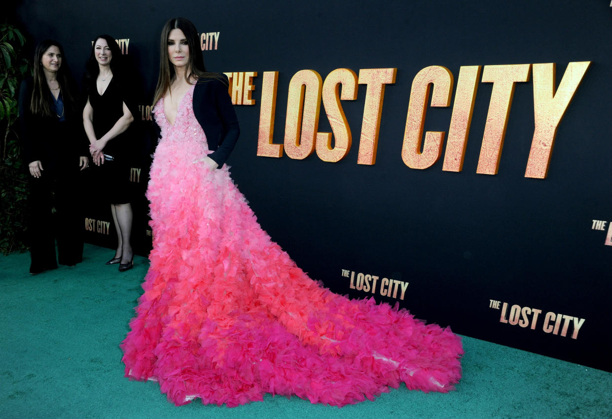 Sandra Bullock wows in her voluminous pink ombre gown at the premiere of 'The Lost City'. (Getty Images)