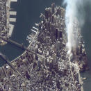 A satellite image of lower Manhattan shows smoke and ash rising from the site of the World Trade Center at 11:43 AM on September 12, 2001. The fires at Ground Zero continued to burn for 99 days after the attack -- a bleak reminder, day and night, of the thousands who lost their lives, and the countless millions more who lived, but whose lives were forever transformed. <br><br>(Photo: Getty Images)<br><br>For the full photo collection, go to <a href="http://www.life.com/gallery/59971/911-the-25-most-powerful-photos#index/0" rel="nofollow noopener" target="_blank" data-ylk="slk:LIFE.com;elm:context_link;itc:0;sec:content-canvas" class="link ">LIFE.com</a>