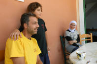 Ahmad Berajikli is pictured with his family as they stay in a former Peloponnese tourist resort that has been turned into a migrant home near the town of Myrsini, southwest of Athens, Greece, August 13, 2016. Picture taken August 13, 2016. REUTERS/Michele Kambas