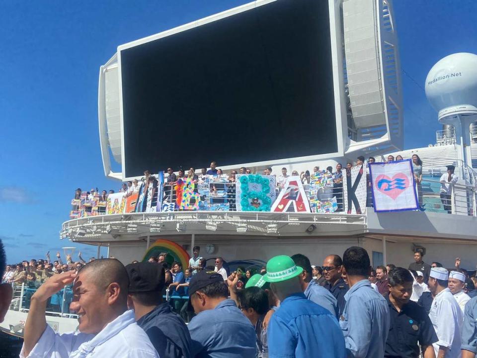Cruise ship workers gather on the deck of the Sky Princess to display a large sign that reads ‘We will be back’ days after the cruising industry came to a halt March 12, 2020. Gan Sungaralingum, a watch salesman onboard Sky Princess, spent 170 days stuck at sea, trying to get back home to the island of Mauritius, during a global pandemic.