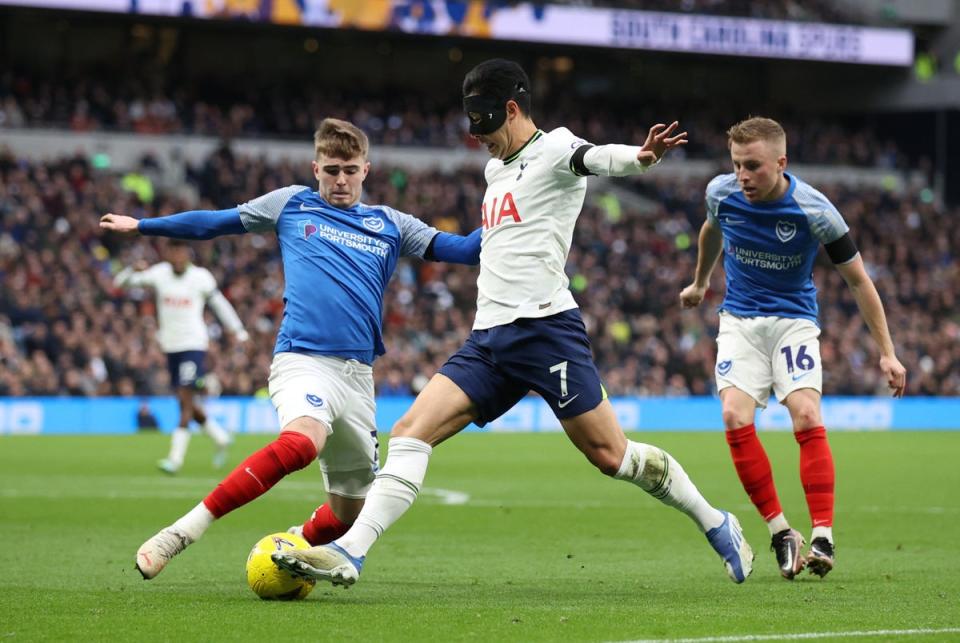 Son Heung-min dribbles at the Portsmouth defence (Reuters)