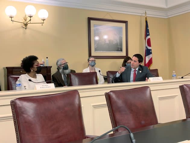 Ohio Elections Chief Frank LaRose, right, speaks during a meeting of the Ohio Redistricting Commission, Aug. 31, 2021, in Columbus, Ohio, as Rep. Emilia Sykes, of Akron, listens. 