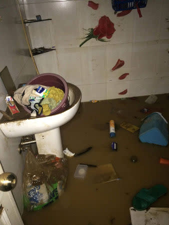 A toilet is submerged in floodwaters from cyclone Vinta at a house in Cagayan de Oro, Philippines, December 22, 2017, in this picture from social media. Twitter/Maria Imbyerna/@bilyuuhh/via REUTERS