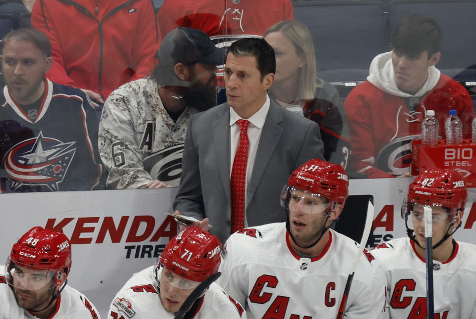 Carolina Hurricanes coach Rod Brind'Amour, top center, watches his team during the third period of an NHL hockey game against the Columbus Blue Jackets in Columbus, Ohio, Saturday, Jan. 7, 2023. (AP Photo/Paul Vernon)