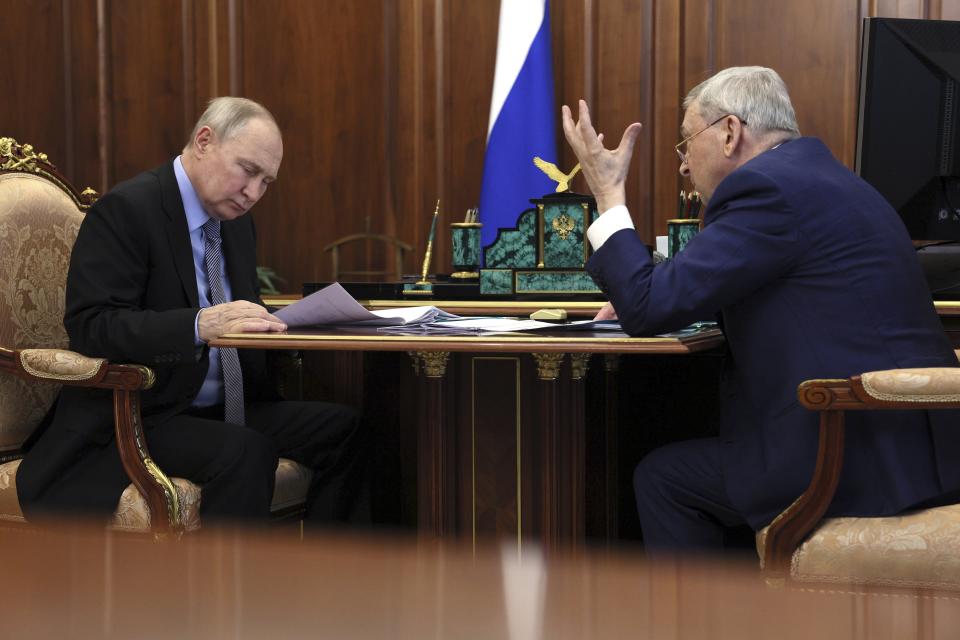 Russian President Vladimir Putin and Ivan Dedov.