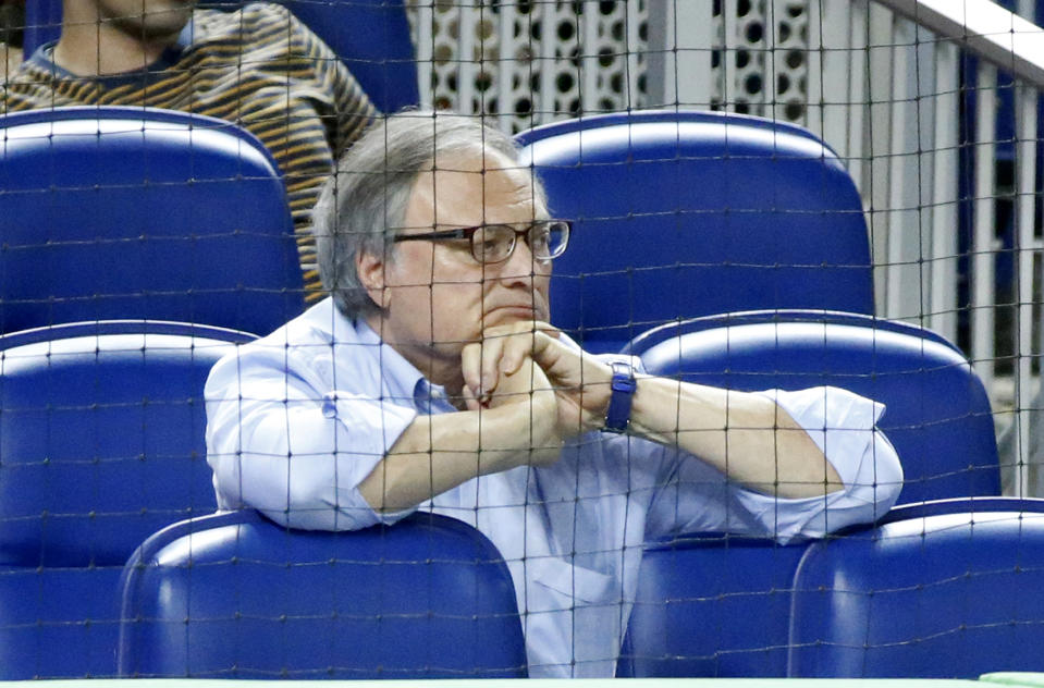 FILE - Miami Marlins owner Jeffrey Loria watches during the eighth inning of a baseball game between the Marlins and the New York Mets in Miami, in this Tuesday, June 27, 2017, file photo. Former Miami Marlins owner Jeffrey Loria reached a lawsuit settlement to reimburse local government $4.2 million for the cost of building Marlins Park, which opened in 2012. (AP Photo/Wilfredo Lee, File)