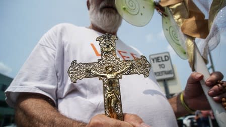 A Pro-Life Supporter protests outside of Planned Parenthood as a deadline looms to renew the license of Missouri's sole remaining Planned Parenthood clinic in St. Louis