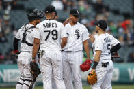 Chicago White Sox starting pitcher Reynaldo Lopez, second right, leaves the game after delivering a pitch against the Detroit Tigers during the ninth inning of game one of a baseball doubleheader, Saturday, Sept. 28, 2019, in Chicago. (AP Photo/Kamil Krzaczynski)