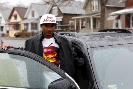 Peer Advocate with the COTI-Center of Treatment Innovation Denton Johnson poses for a photo on Winding Way in Binghamton, New York, U.S., April 6, 2018. REUTERS/Andrew Kelly