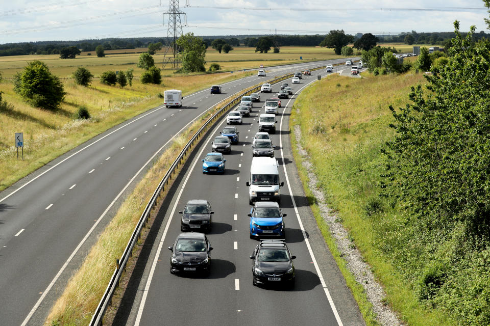 YORK, ENGLAND - JULY 04: Protesters slow the traffic down on the A64 on July 04, 2022 in York, England. Prices for petrol and diesel have risen steadily this year as the price of oil has climbed, due to post-pandemic demand and sanctions against Russia, one of the world's largest oil exporters. (Photo by Cameron Smith/Getty Images)