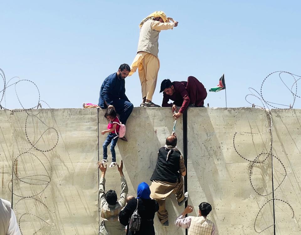 KABUL, AFGHANISTAN-AUGUST 16: Thousands of Afghans rush to the Hamid Karzai International Airport as they try to flee the Afghan capital of Kabul, Afghanistan, on August 16, 2021. (Photo by Haroon Sabawoon/Anadolu Agency via Getty Images)