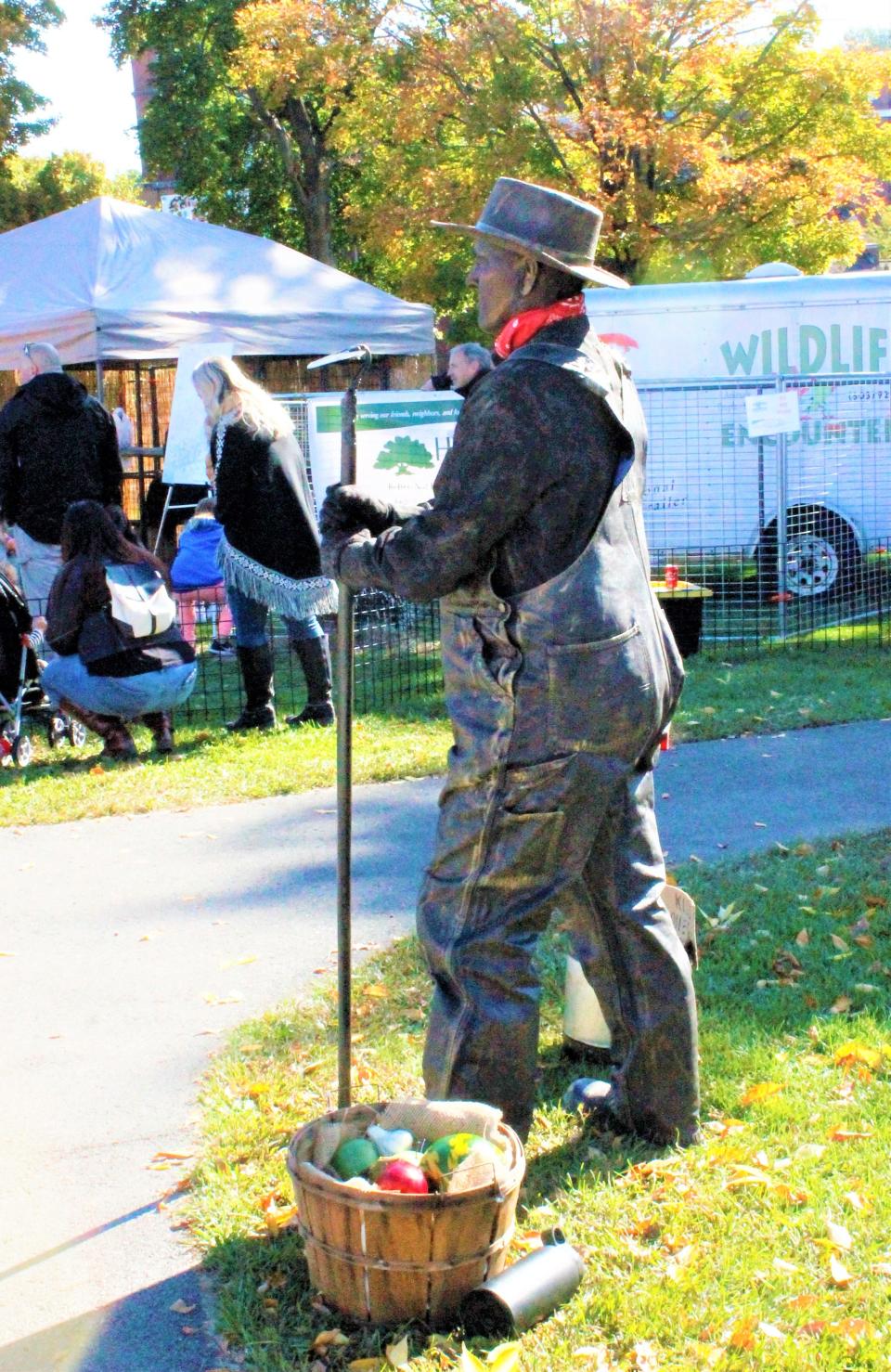 Deb Cram poses as a living statue at a previous Apple Harvest Day event in Dover.