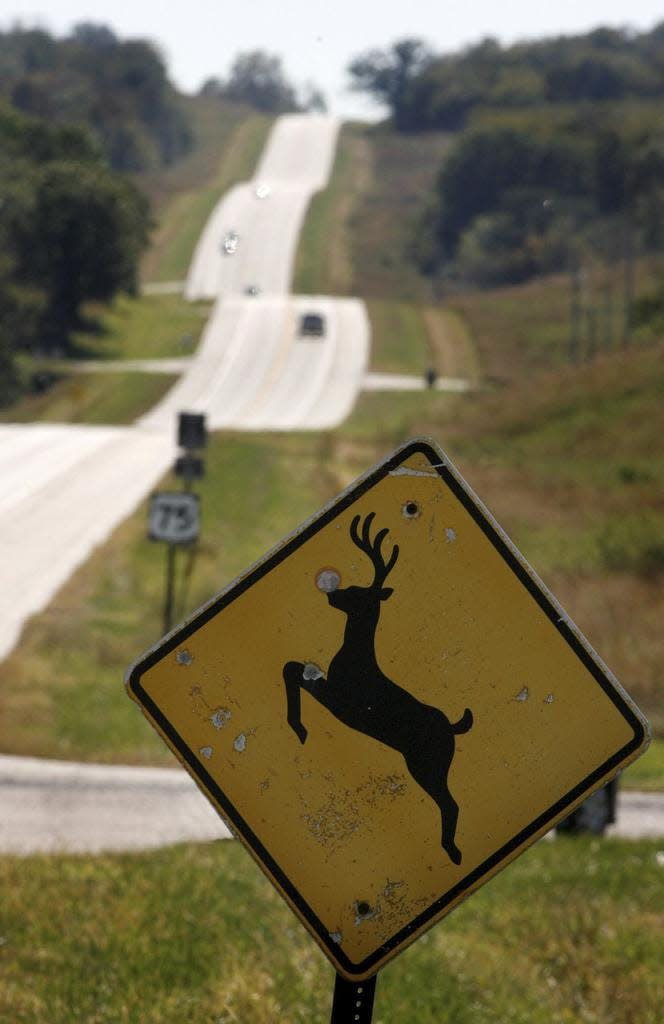 In this Oct. 8, 2007 photo, a deer crossing sign looks south on Highway 50 in Nebraska City, Neb. (Kent Sievers/Omaha World-Herald via AP)