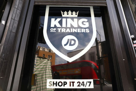 FILE PHOTO: A sign for a JD Sports store is displayed in a window in London, Britain April 11, 2017. REUTERS/Neil Hall/File Photo