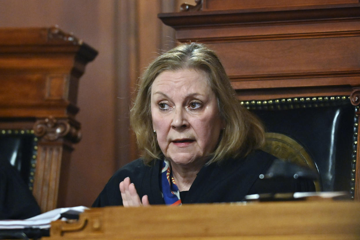 Kentucky Supreme Court Justice Lisabeth Hughes asks a question to the attorney for the American Civil Liberties Union as they hear arguments whether to temporarily pause the state's abortion ban in Frankfort, Ky., Tuesday, Nov. 15, 2022. (AP Photo/Timothy D. Easley)