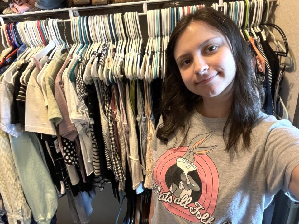 author in front of her closet