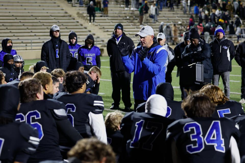 Hilliard Bradley coach Mike LoParo applauds his players after Friday night's loss.