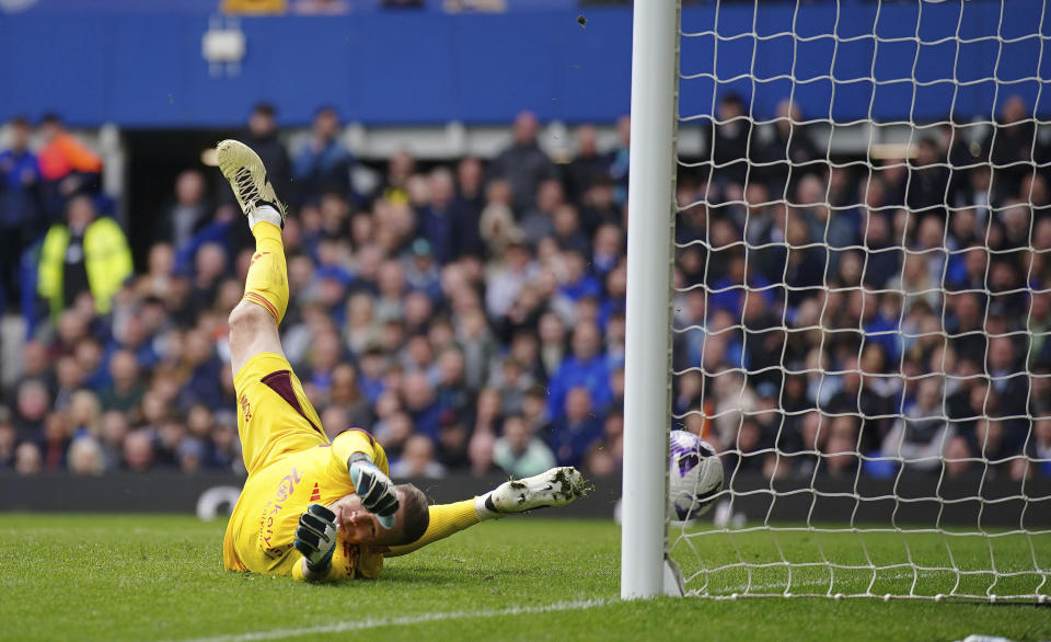 Nottingham Forest goalkeeper Matz Sels attempts to save a shot from Everton's Dwight McNeil, not pictured, during the English Premier League soccer match between Everton and Nottingham Forest at Goodison Park, Liverpool, England, Sunday April 21, 2024. (Peter Byrne/PA via AP)