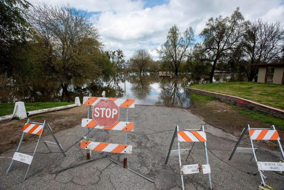 Barricades placed across a road at Hagaman Park in Livingston, Calif., on Sunday, April 2, 2023.