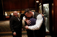 <p>Employees embrace on their last day of work, in the main lobby of the Waldorf Astoria hotelin New York, Feb. 28, 2017. (Photo: Mike Segar/Reuters) </p>