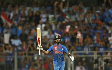 Cricket - West Indies v India - World Twenty20 cricket tournament semi-final - Mumbai, India - 31/03/2016. India's Virat Kohli celebrates after scoring his half century. REUTERS/Danish Siddiqui