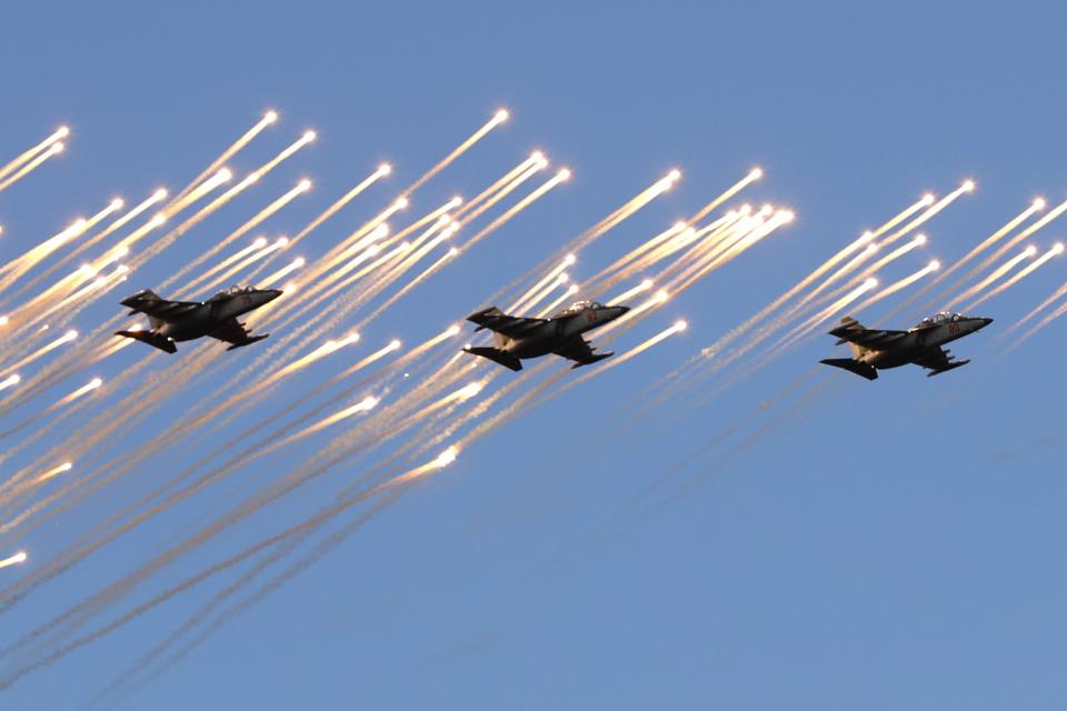 FILE - Belarusian army Su-25 jet fighters fly during a parade marking Independence Day in Minsk, Belarus, Wednesday, July 3, 2019. Russian President Vladimir Putin has announced that he intends to deploy tactical nuclear weapons on the territory of Belarus. The move appears to be another attempt by Putin to raise the stakes in the conflict in Ukraine. (AP Photo/Sergei Grits, File)