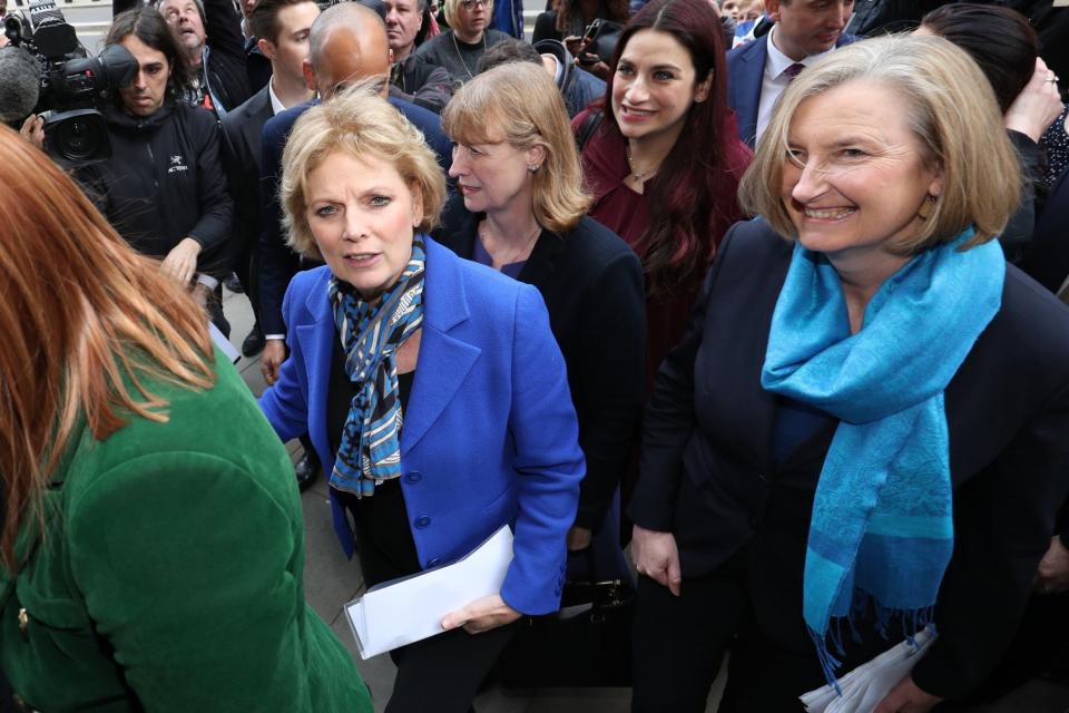 Anna Soubry (blue jacket) and Sarah Wollaston (blue scarf), with Luciana Berger (red jacket) arrive to speak after quitting their respective parties (PA)