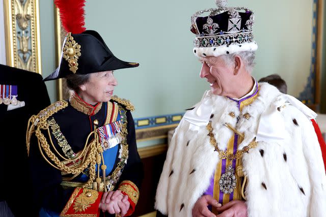 <p>Chris Jackson/Getty </p> Princess Anne and King Charles share a smile at Buckingham Palace on his May 6 coronation day.
