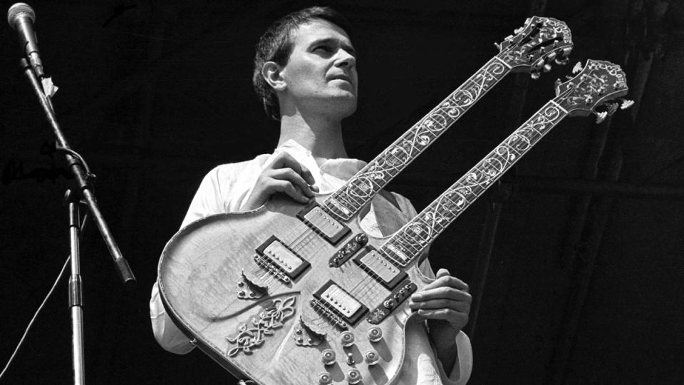 John McLaughlin performing on stage with Mahavishnu Orchestra at Knebworth Festival, Knebworth House, Hertfordshire, 20 July 1974.