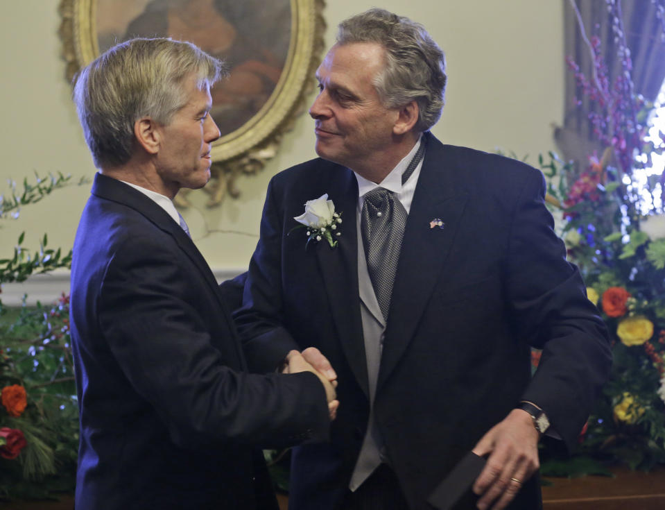 Virginia Gov. Bob McDonnell, left, shakes the hand of Gov-elect Terry McAuliffe, prior to the inauguration at the Capitol in Richmond, Va., Saturday, Jan. 11, 2014. McAuliffe was sworn Saturday in as the 72nd governor of Virginia. (AP Photo/Steve Helber)