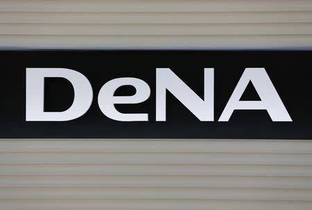 Japanese gaming firm DeNA Co's logo is pictured in front of the company's headquarters in Tokyo December 13, 2012. REUTERS/Yuriko Nakao