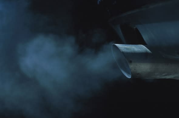 a exhaust pipe of a car emitting fumes