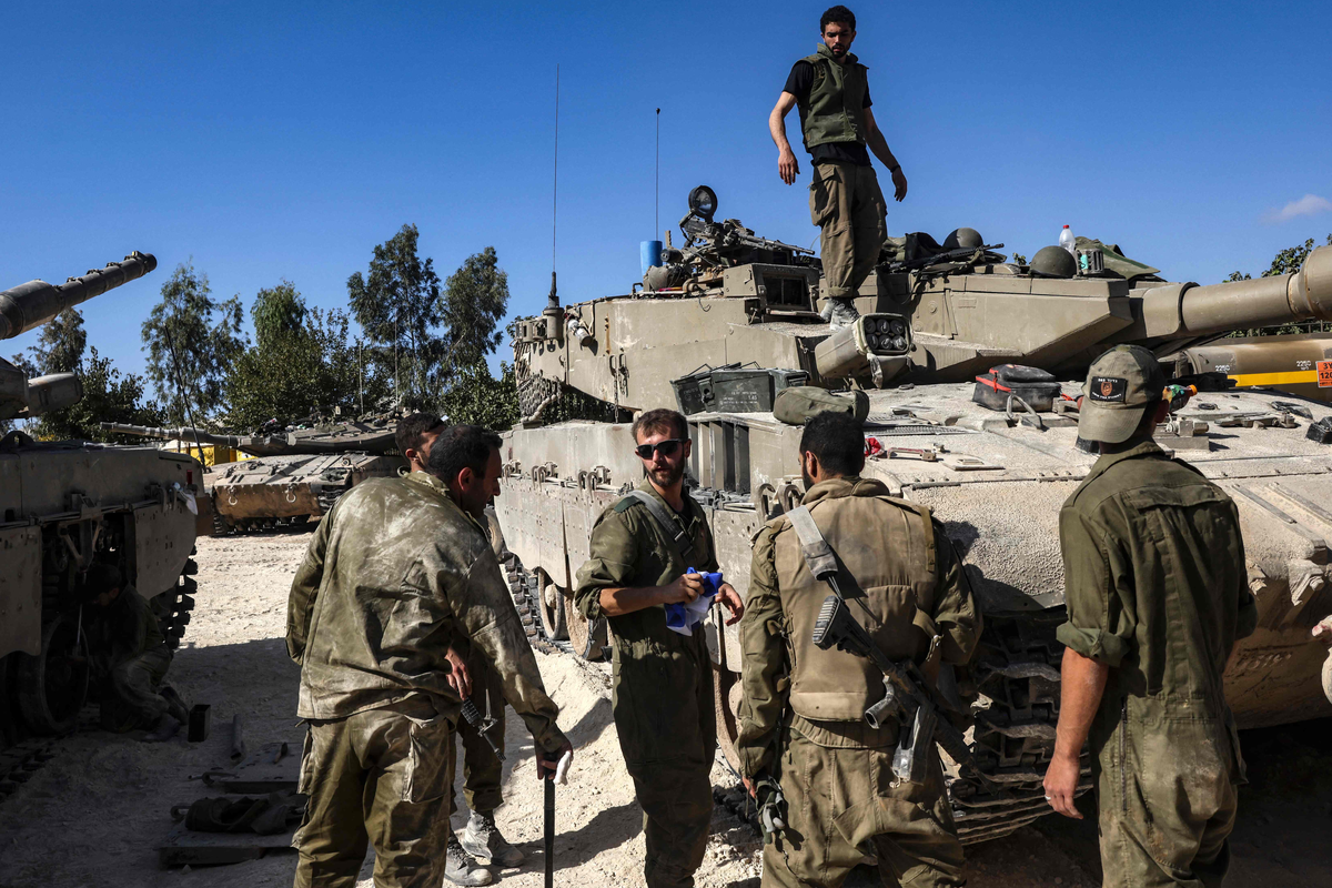 Israeli soldiers gather near the border with Gaza (AFP via Getty Images)