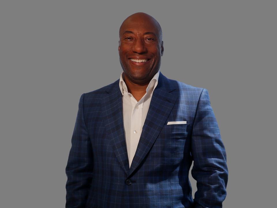 Byron Allen headshot, comedian and media mogul, graphic element on gray 