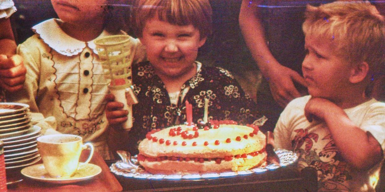 child smiling at simple birthday party