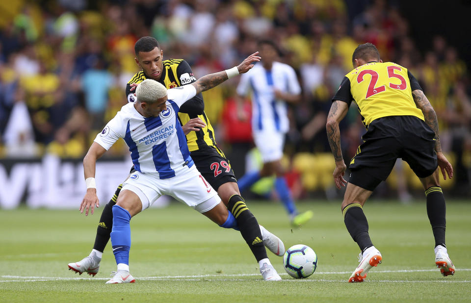 Brighton & Hove Albion's Anthony Knockaert, front, battles with Watford's Etienne Capoue and Jose Holebas, right, during their English Premier League soccer match at Vicarage Road in London, England, Saturday Aug. 11, 2018. (Nigel French/PA via AP)