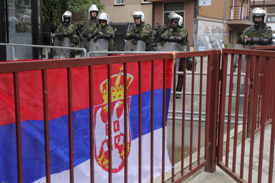 KFOR soldiers guard the city hall during a protest in the town of Zvecan, northern Kosovo, Wednesday, May 31, 2023. Hundreds of ethnic Serbs began gathering in front of the city hall in their repeated efforts to take over the offices of one of the municipalities where ethnic Albanian mayors took up their posts last week. (AP Photo/Bojan Slavkovic)