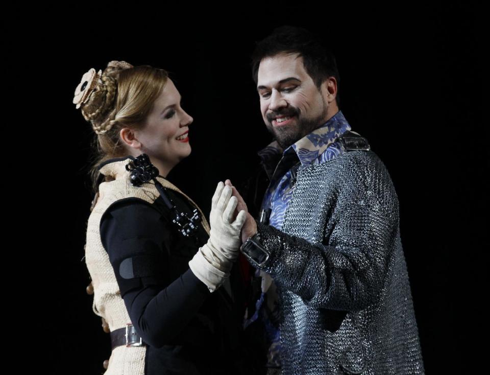 In this Feb. 24, 2012 photo, Julia Kleiter, left, who plays Almirena, the love interest of Rinaldo, right, played by David Daniels, performs during the final dress rehearsal at the Lyric Opera of Chicago's production of Rinaldo. (AP Photo/Charles Rex Arbogast)