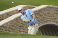 Ben Kohles hits onto the 18th green during the final round of the Byron Nelson golf tournament in McKinney, Texas, Sunday, May 5, 2024. (AP Photo/LM Otero)