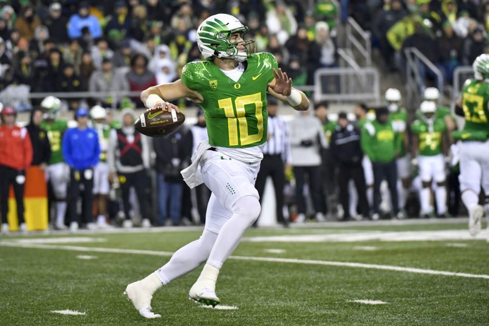 Oregon quarterback Bo Nix looks to pass against Utah