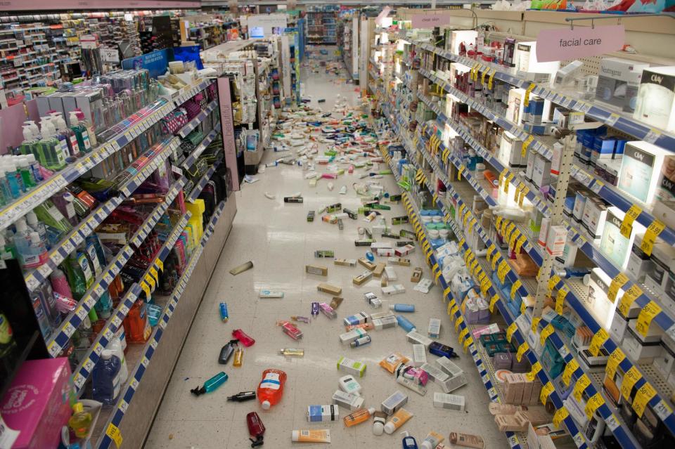 Merchandise is strewn across the floor in a La Habra Walgreens following a 5.1 earthquake centered near La Habra Friday night March 28, 2014. (AP Photo/The Orange County Register, Blaine, Ohigashi)