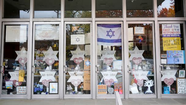 PHOTO: A memorial is placed inside the locked doors of the dormant landmark Tree of Life synagogue in Pittsburgh's Squirrel Hill neighborhood, Oct. 26, 2022. (Gene J. Puskar/AP)