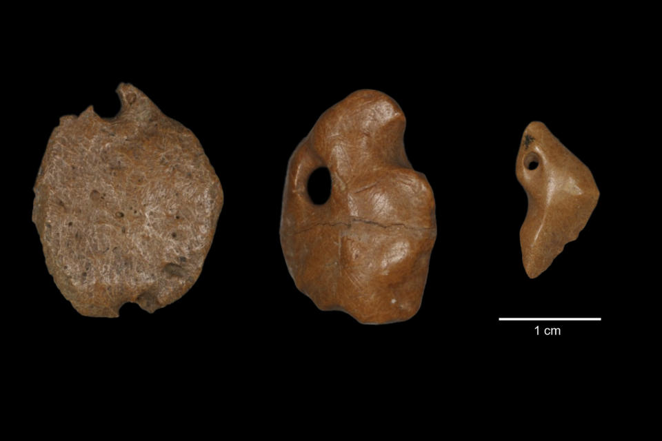 This image provided by researchers shows artifacts made of bony material from a giant sloth discovered at a rock shelter in Brazil, recovered from archaeological layers dated to 25,000 to 27,000 years ago. Research published Wednesday, July 12, 2023, in Britain's Proceedings of the Royal Society B journal, suggests humans lived in South America at the same time as now-extinct giant sloths, bolstering evidence that people arrived in the Americas earlier than once thought. (Thais Rabito Pansani via AP)